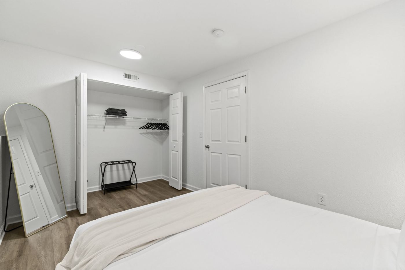 Basement bedroom closet and mirror