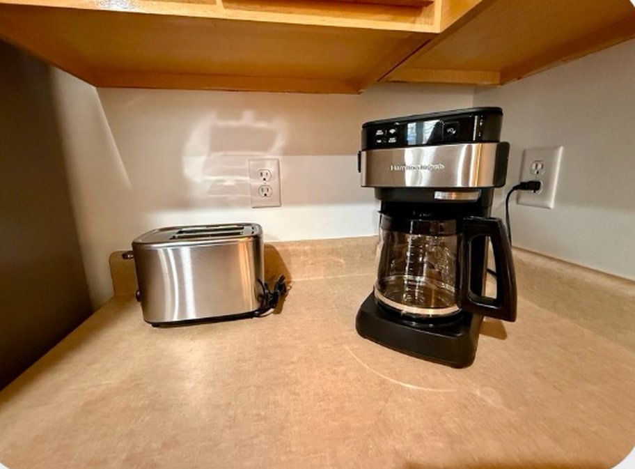 Coffee maker and toaster on the counter