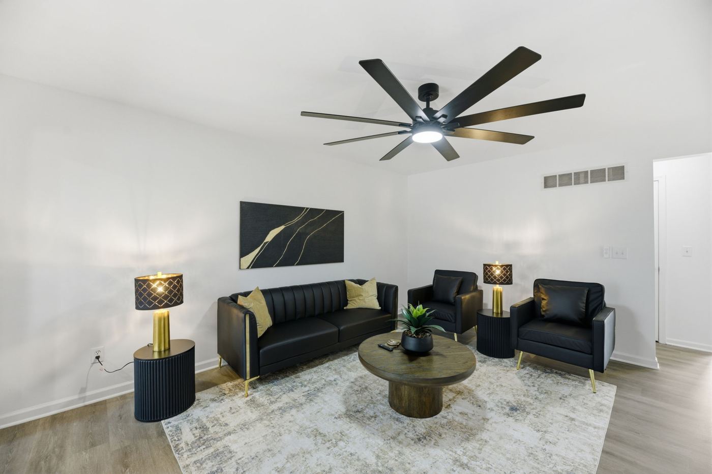 Living room seating area under a ceiling fan