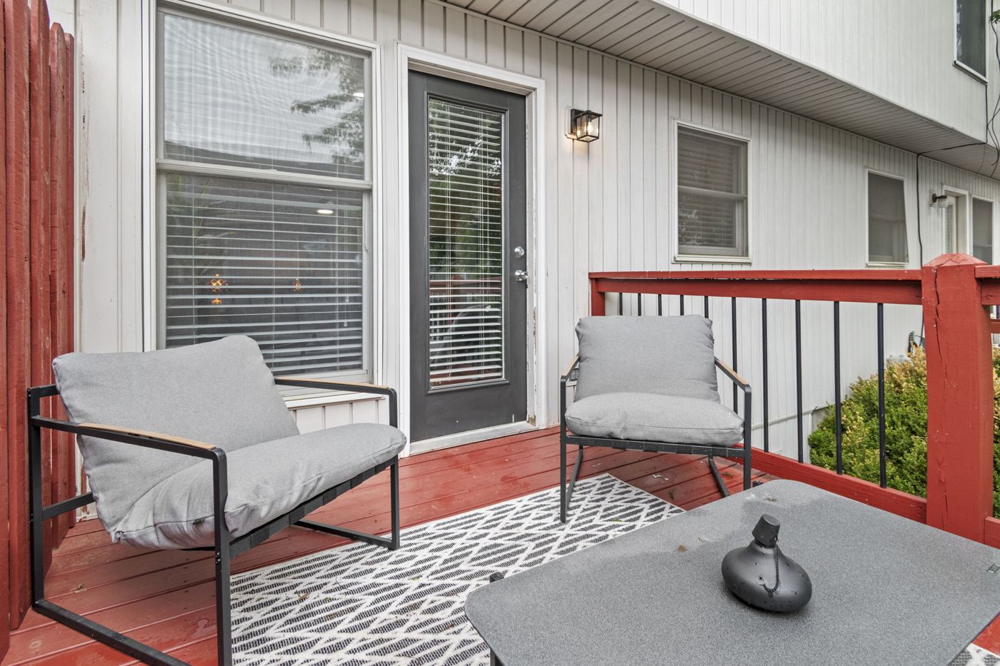 Balcony chairs and table by the door